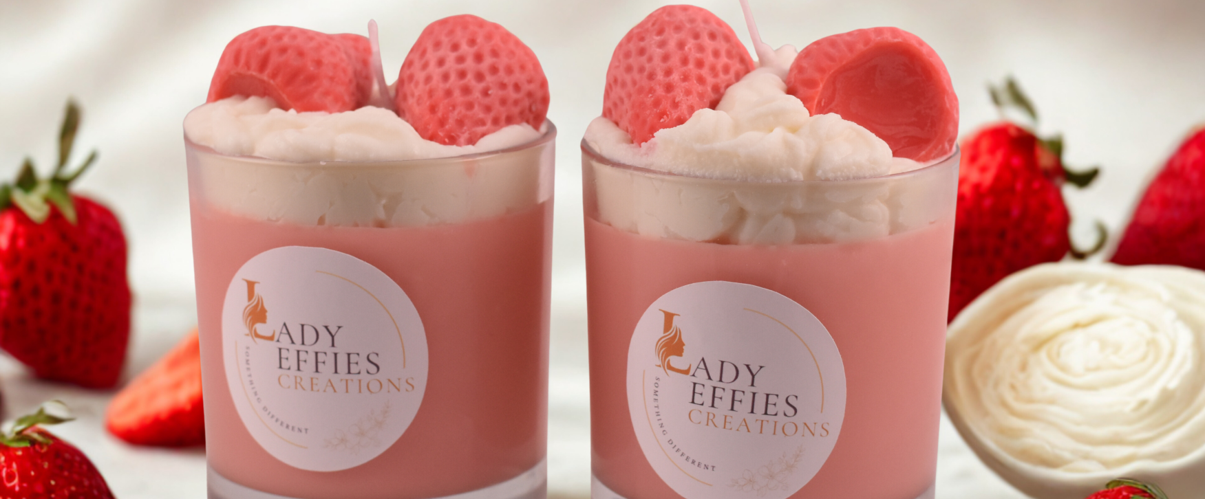 candles in jars with decorative strawberries and cream