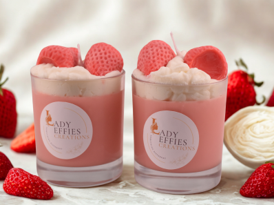 candles in jars with decorative strawberries and cream