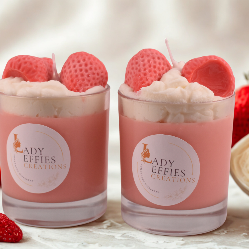 candles in jars with decorative strawberries and cream